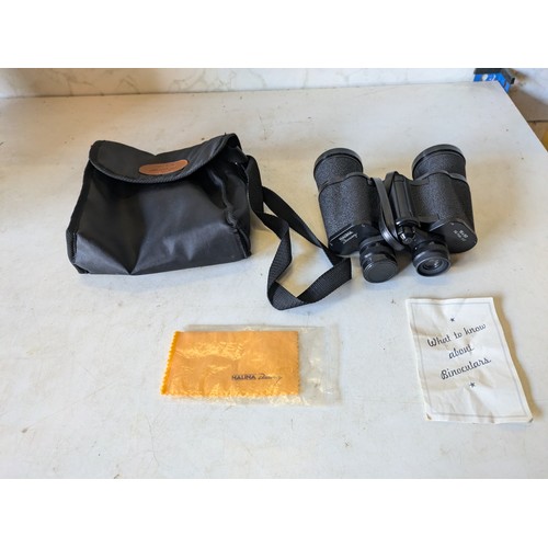 491 - a pair of Halina Discovery 16x50 binoculars in case