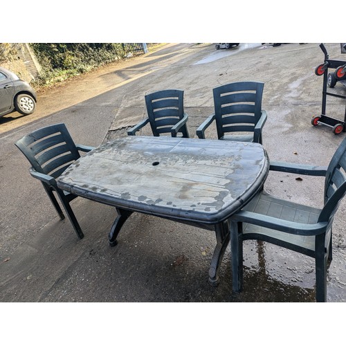 22 - a green plastic table and 4 chair set