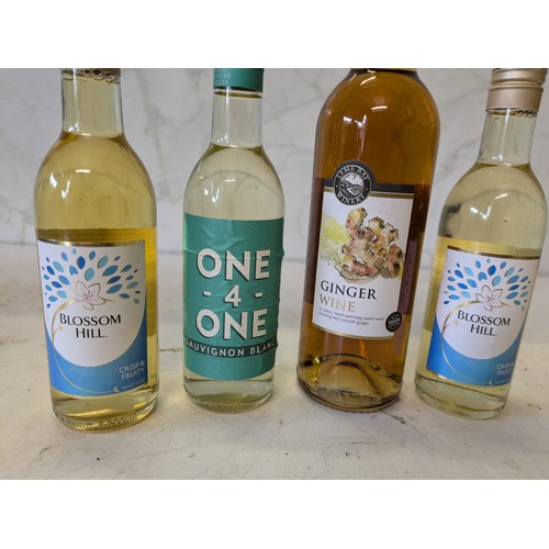 398 - a selection of 3 bottles of wine and a ginger wine