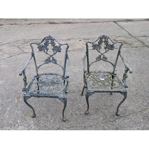 38 - A Pair Of Cast Iron Garden Armchairs