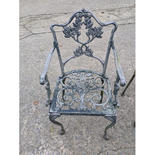 38 - A Pair Of Cast Iron Garden Armchairs