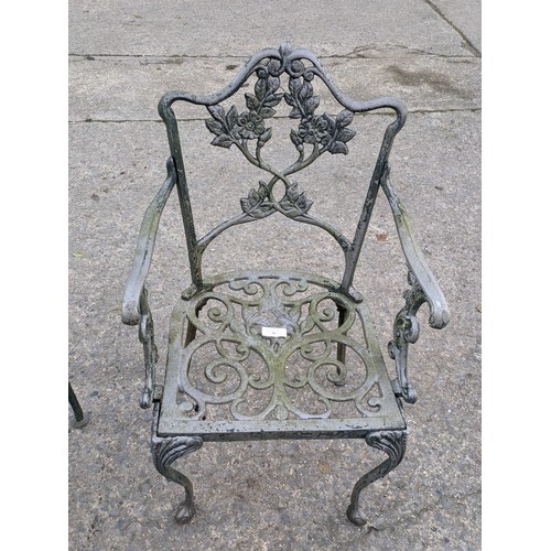 38 - A Pair Of Cast Iron Garden Armchairs