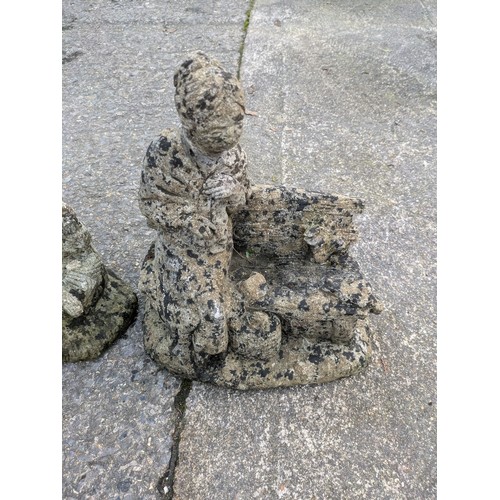 42 - A Pair Of Stone Figures On A Bench