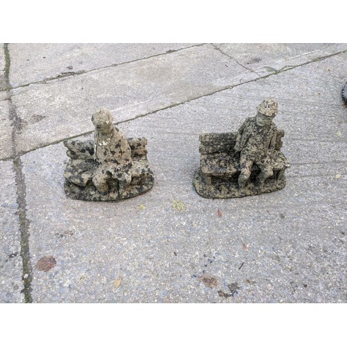 41 - A Pair Of Stone Figures On A Bench