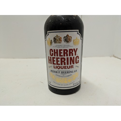 497 - A 1 Litre Bottle Of Cherry Herring Liqueur