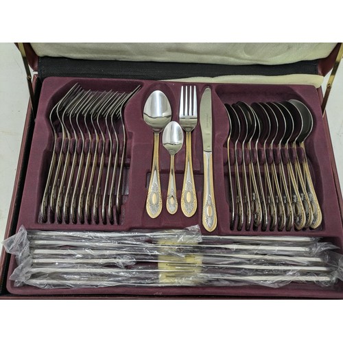 522 - A Prima Stainless Steel And Brass Accented Cutlery Set In Case