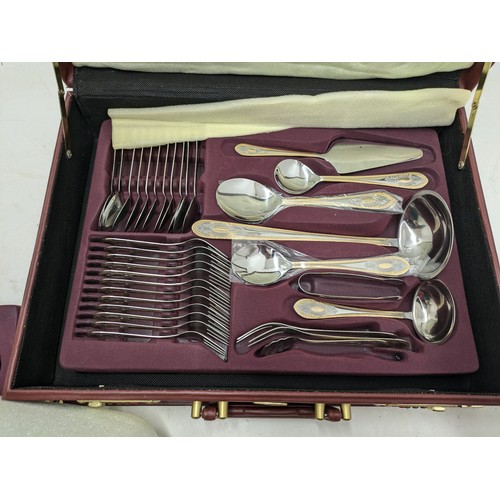 522 - A Prima Stainless Steel And Brass Accented Cutlery Set In Case