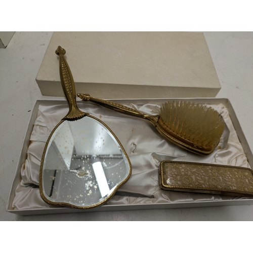 613 - A vintage vanity set (mirror and brushes)