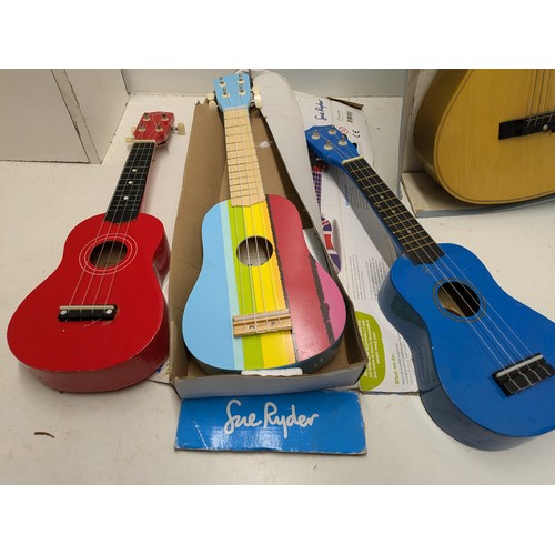 550 - A Selection Of 3 Ukuleles And A Children's Acoustic Guitar