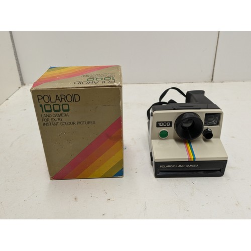 216 - Polaroid 1000 Land Camera In Its Original Box And A Kodak Film Camera