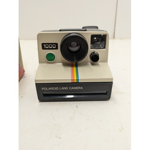 216 - Polaroid 1000 Land Camera In Its Original Box And A Kodak Film Camera