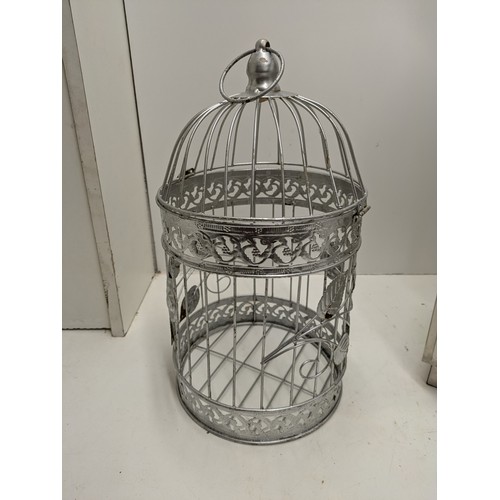 533 - A Large Glass Candle Holder And A Bird Cage Candle Holder