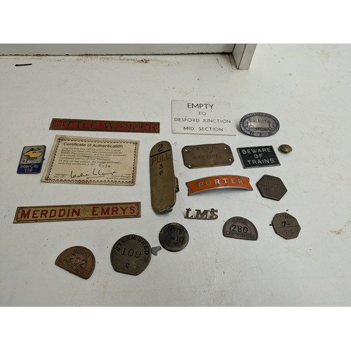 587 - A selection of train badges and signs