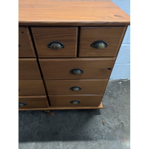 597 - Pine 10 drawer graduated chest of drawers