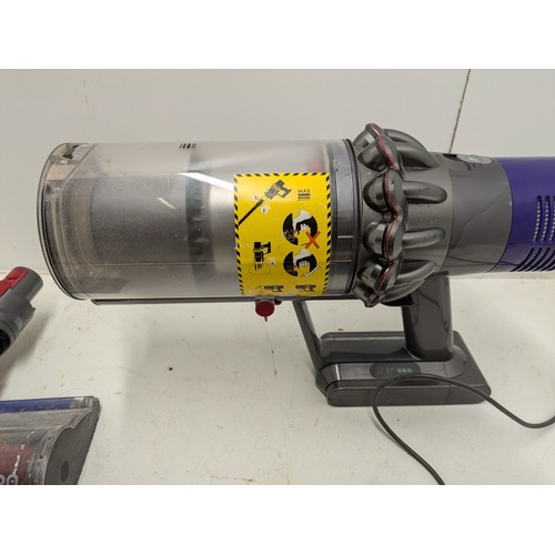 259 - Dyson v10 cordless vacuum with charger - working