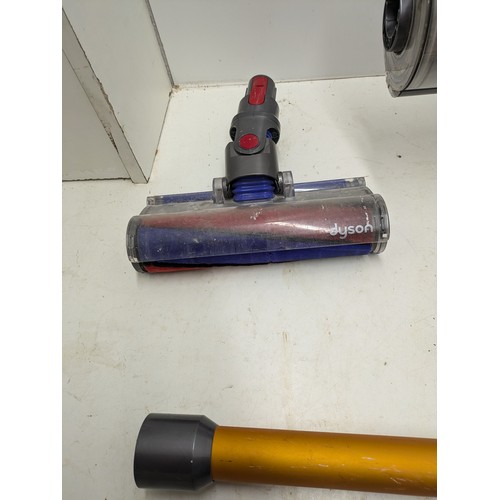 259 - Dyson v10 cordless vacuum with charger - working