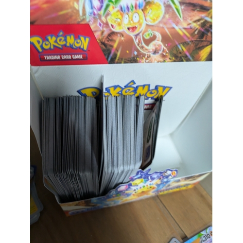 615 - A large quantity of Pokémon cards - some in protective sleeves - (surging sparks)