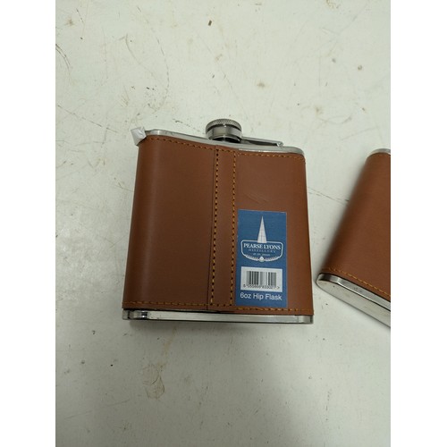 1062 - A Pair of Leather Covered Please Hip Flasks