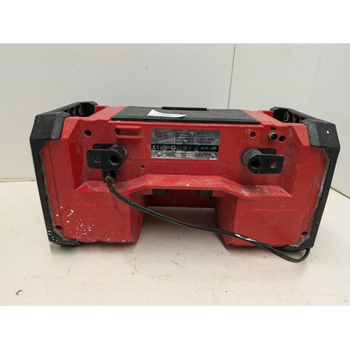 829 - A Milwaukee M18JSR Site Radio and Battery Charger