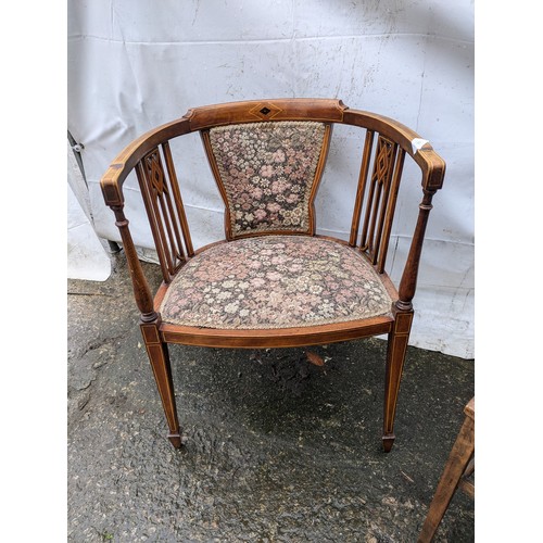 216 - A pair of chairs - One Victorian Pine armchair with a floral and ornate design