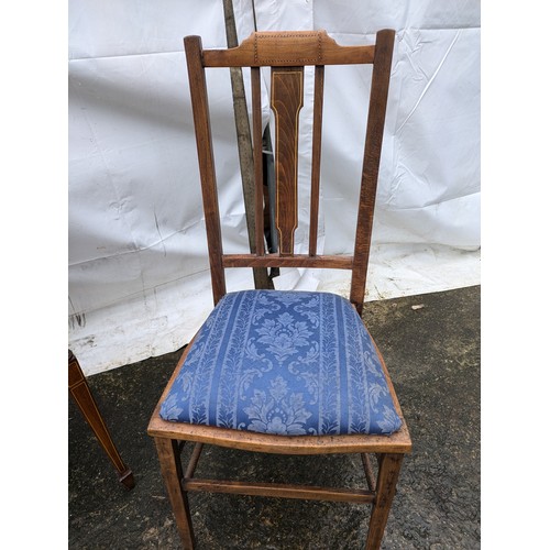 216 - A pair of chairs - One Victorian Pine armchair with a floral and ornate design