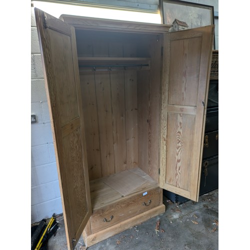 235 - A Pitch Pine Wardrobe With Single Drawer To the Base