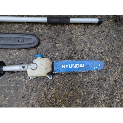 12 - A Hyundai Euro E92016 petrol Strimmer with extension and chainsaw attachment