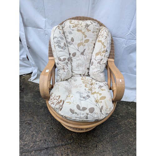 202 - A Wicker and Oak Vernier Lounge Chair, With Gold And Cream Floral Patterned Cushioms