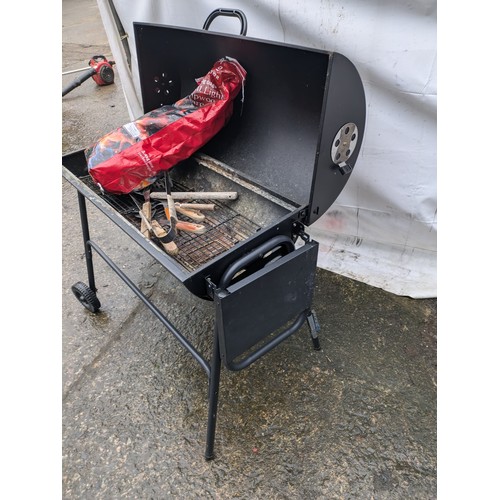 45 - A Modern Black Steel Barbecue With Coal and Grill Set