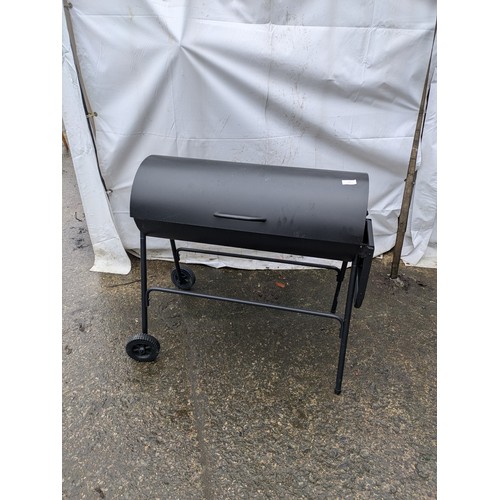 45 - A Modern Black Steel Barbecue With Coal and Grill Set