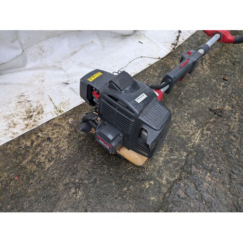 23 - A Kawasaki model 500325 Petrol Strimmer