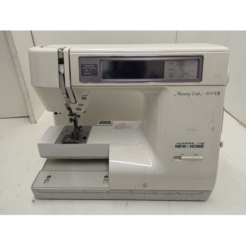 671 - A Janome New Home Memory Craft 800CE Sewing Machine With Case