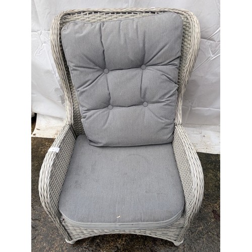 46 - A Grey Wicker Reclining Armchair and Grey Pillows