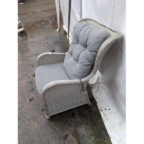 46 - A Grey Wicker Reclining Armchair and Grey Pillows