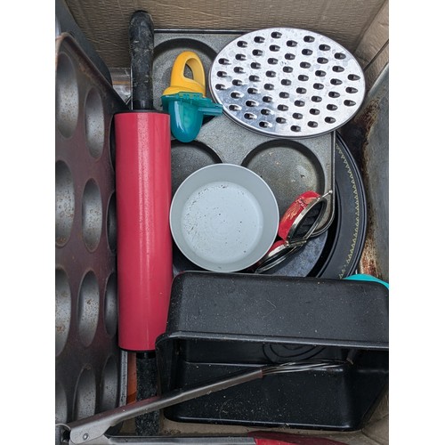 1046 - A Large Selection of Metal Cooking trays and Other Kitchen Equipment