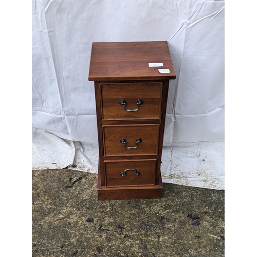 206 - A small Oak veneered bedside table with 3 drawers and brass handles