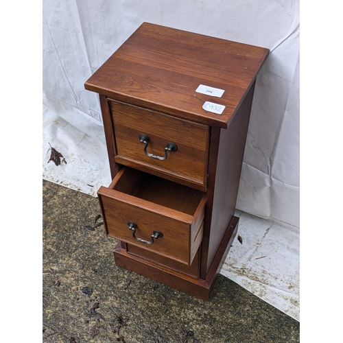 206 - A small Oak veneered bedside table with 3 drawers and brass handles