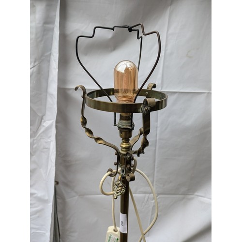 228 - A Brass 3 Footed Floor Lamp With Edison Bulb