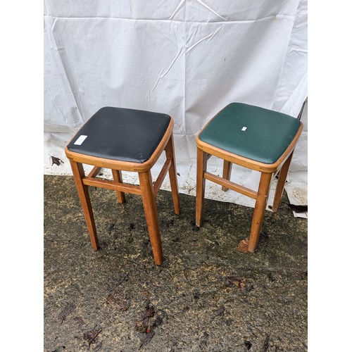 207 - A pair of 70s stools with leather seat bases