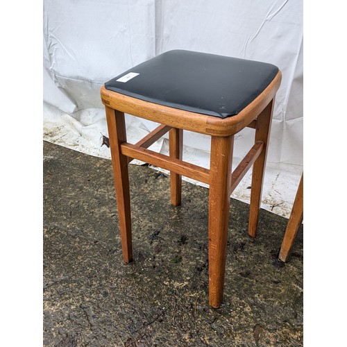 207 - A pair of 70s stools with leather seat bases