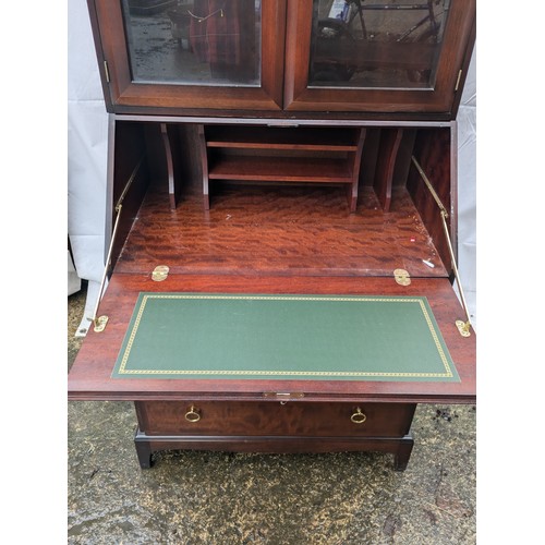 224 - A Stag Mahogany Varniered Pine Bureau with 5 Drawers and a top display cabinet section