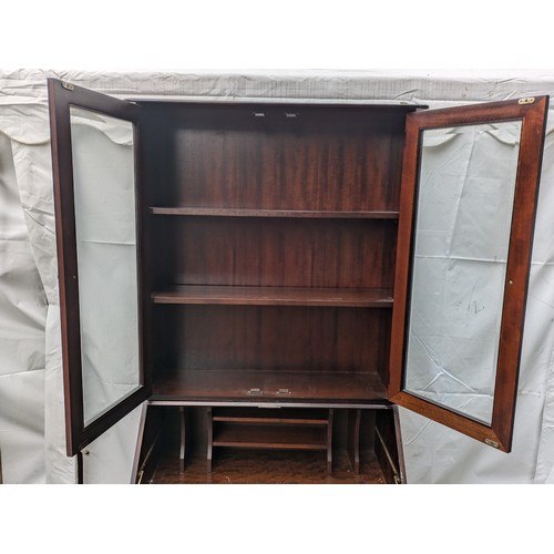 224 - A Stag Mahogany Varniered Pine Bureau with 5 Drawers and a top display cabinet section