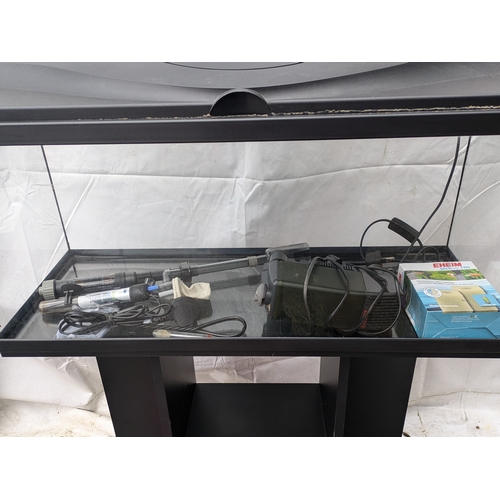 1136 - A large fishtank on stand with accessories