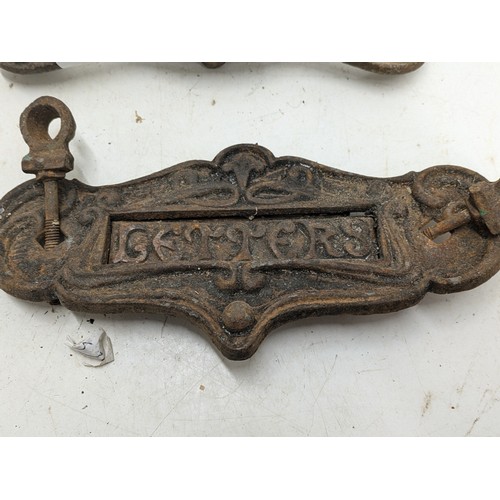 408 - An antique Wrought Iron Door Knocker And Letter Box With Ornate Detailing