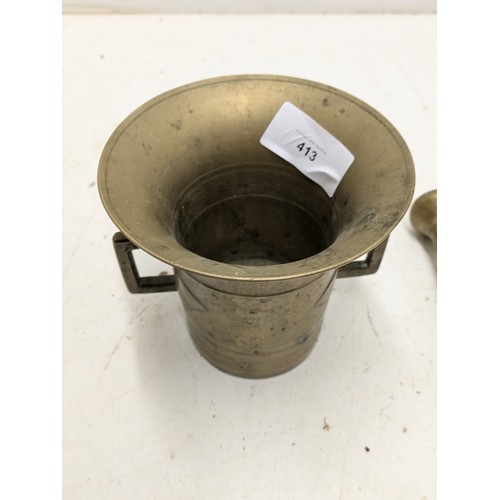 413 - A Heavy Brass Pestle And Mortar With Handles