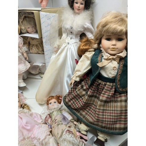 1101 - A Selection Of Porcelain Dolls including 4 Boxed and Several loose