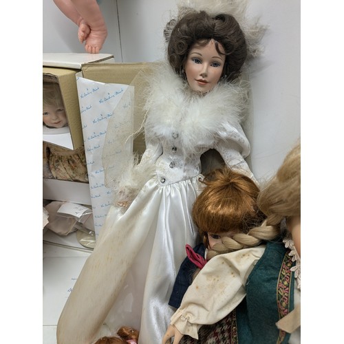 1101 - A Selection Of Porcelain Dolls including 4 Boxed and Several loose