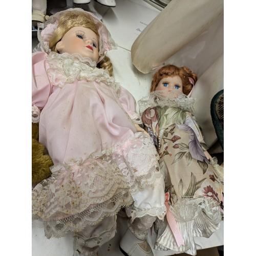 1101 - A Selection Of Porcelain Dolls including 4 Boxed and Several loose