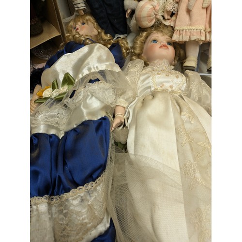 1101 - A Selection Of Porcelain Dolls including 4 Boxed and Several loose