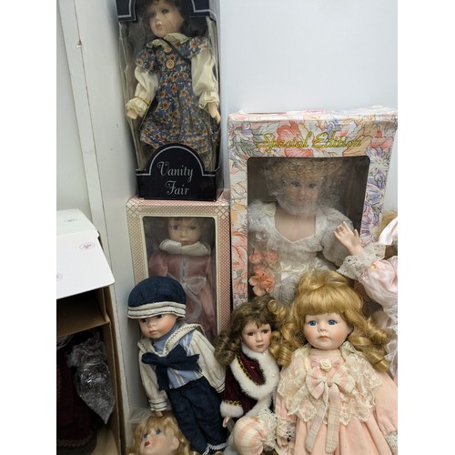 1101 - A Selection Of Porcelain Dolls including 4 Boxed and Several loose